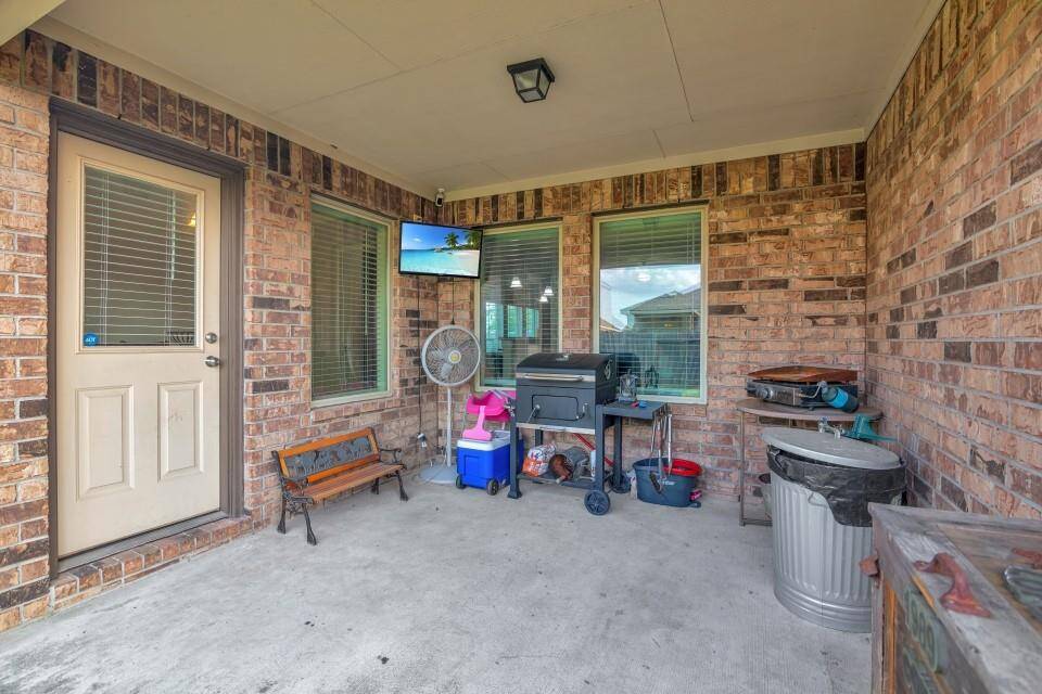 Enjoy the outdoors under this large covered patio.