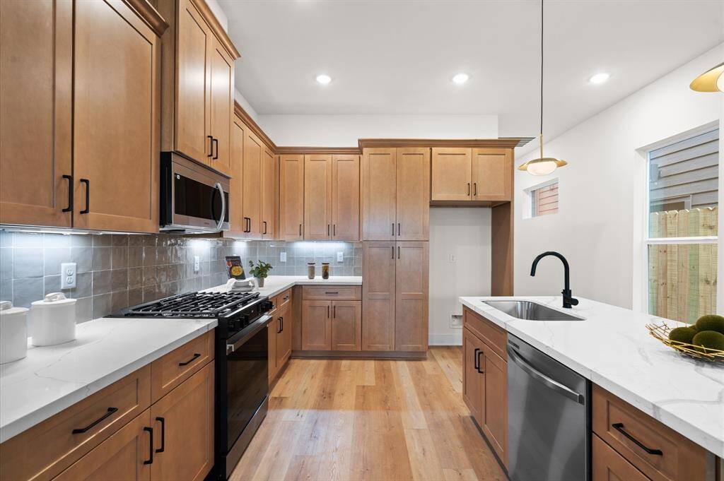 Zellige mosaic tile backsplash.*Photos from a previous home by the same developer, selections and floor plans may vary*