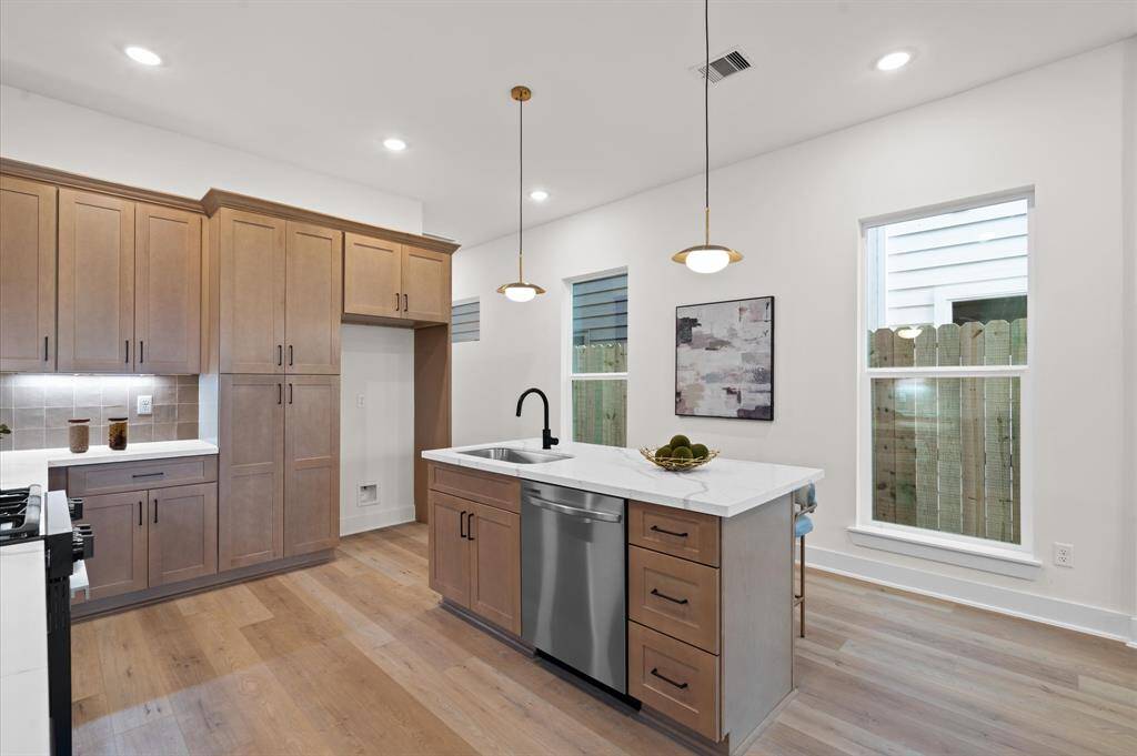 Stainless steel appliances and gorgeous cabinetry.*Photos from a previous home by the same developer, selections and floor plans may vary*