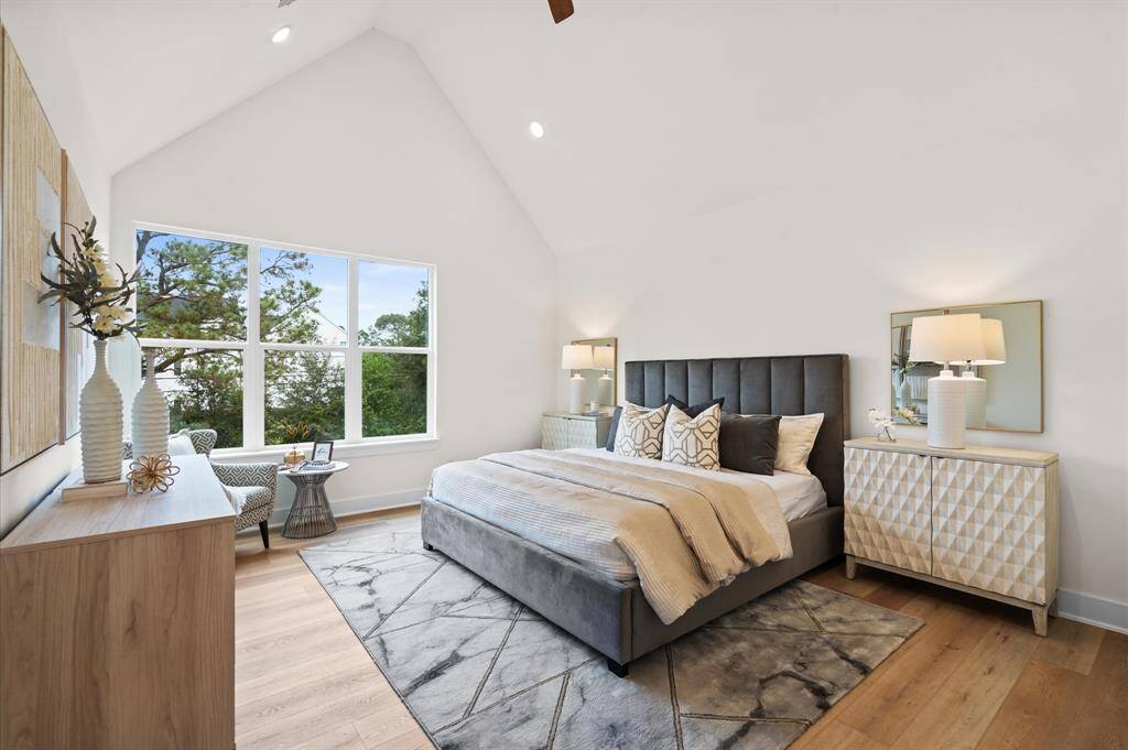 Stunning primary bedroom with cathedral ceilings and sweeping view.*Photos from a previous home by the same developer, selections and floor plans may vary*
