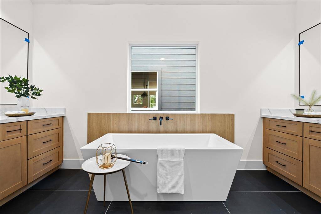 Primary spa like ensuite bath.*Photos from a previous home by the same developer, selections and floor plans may vary*