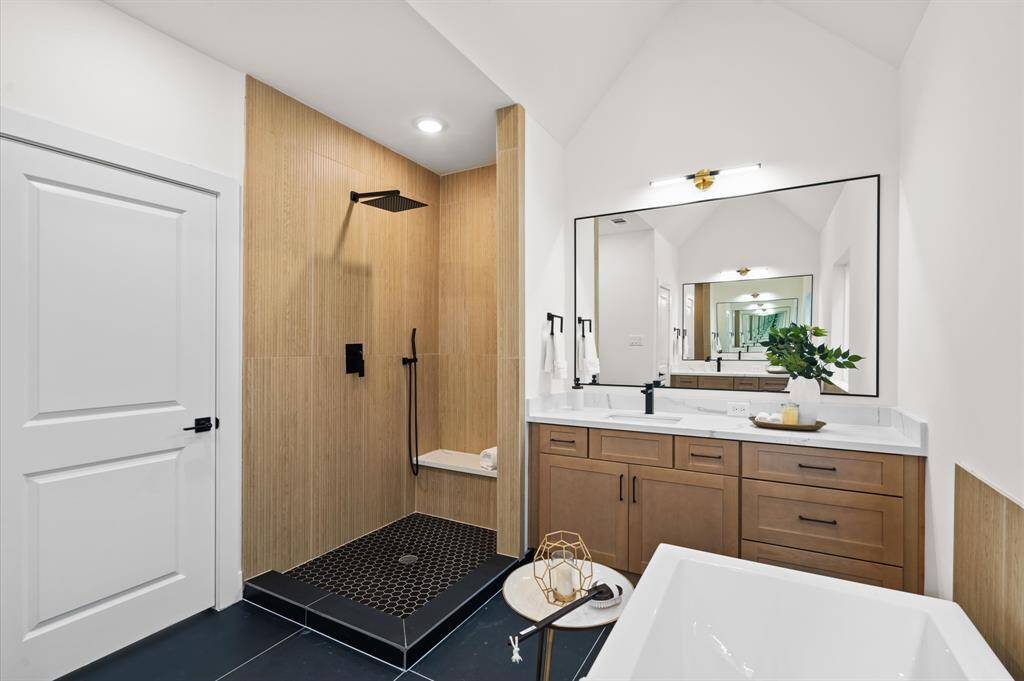 Beautiful walk-in shower.*Photos from a previous home by the same developer, selections and floor plans may vary*