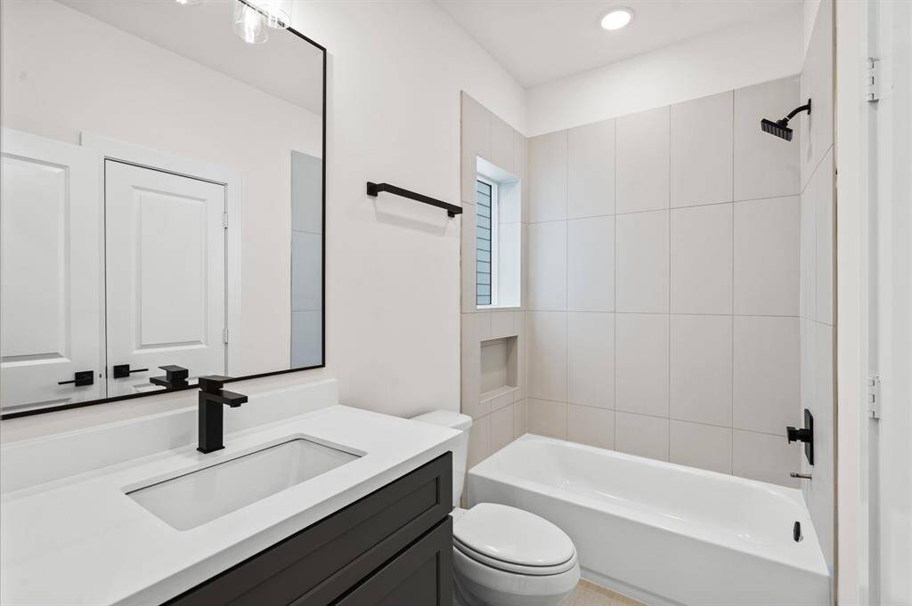 Ensuite secondary bath.*Photos from a previous home by the same developer, selections and floor plans may vary*