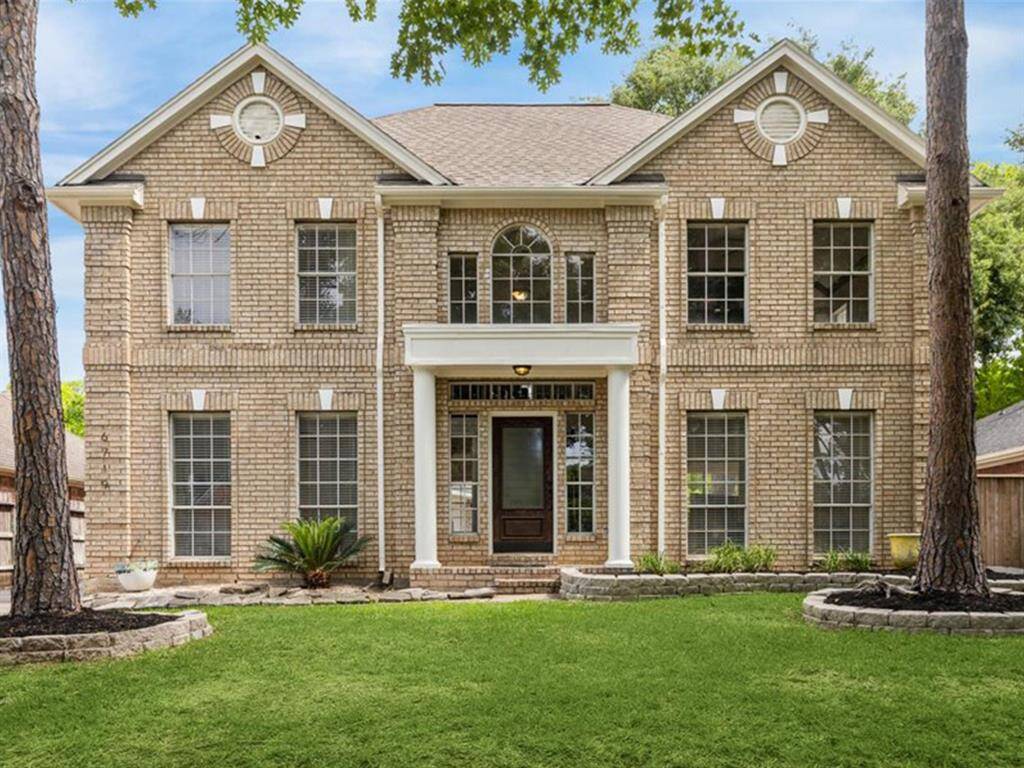 NEW EXTERIOR PAINT, MATURE TREES, CURBED PLANTER BEDS, AND A PRIVATE 2-CAR DETACHED GARAGE MAKE THIS HOME A TRUE GEM IN GREATWOOD KNOLL.