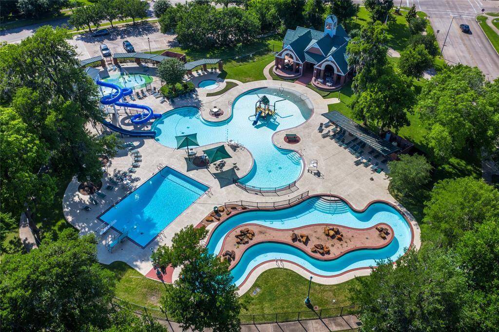 GREATWOOD HAS 3 COMMUNITY POOLS - THIS ONE IS THE NEWEST AND INCLUDES A LAZY RIVER, 2 WATER SLIDES, SPLASH PAD, DEEP POOL WITH 2 DIVING BOARDS, BABY POOL, AND A LARGE SHALLOW PLAY POOL AREA!
