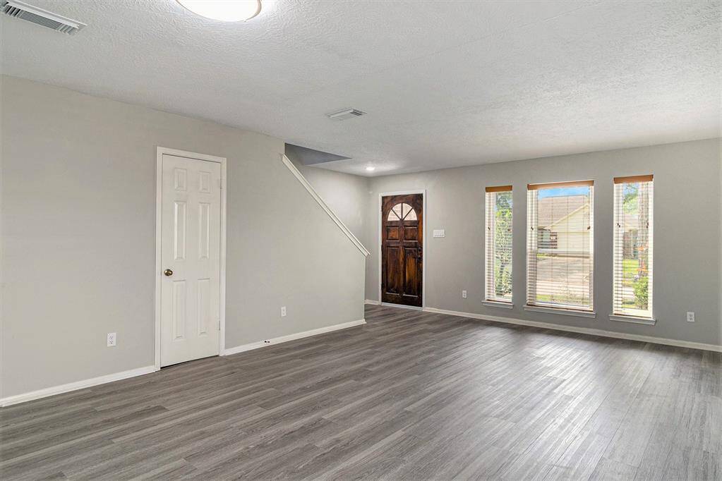 Coat closet under the stairs