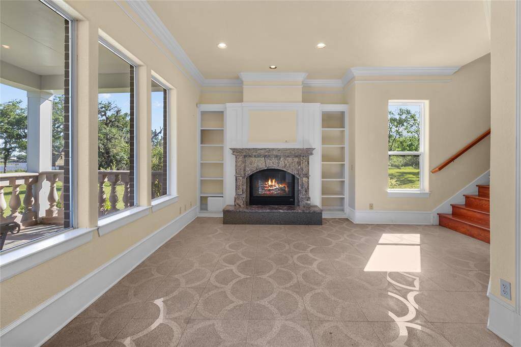 Convenient downstairs utility room with ample cabinet storage and appliance hookups.