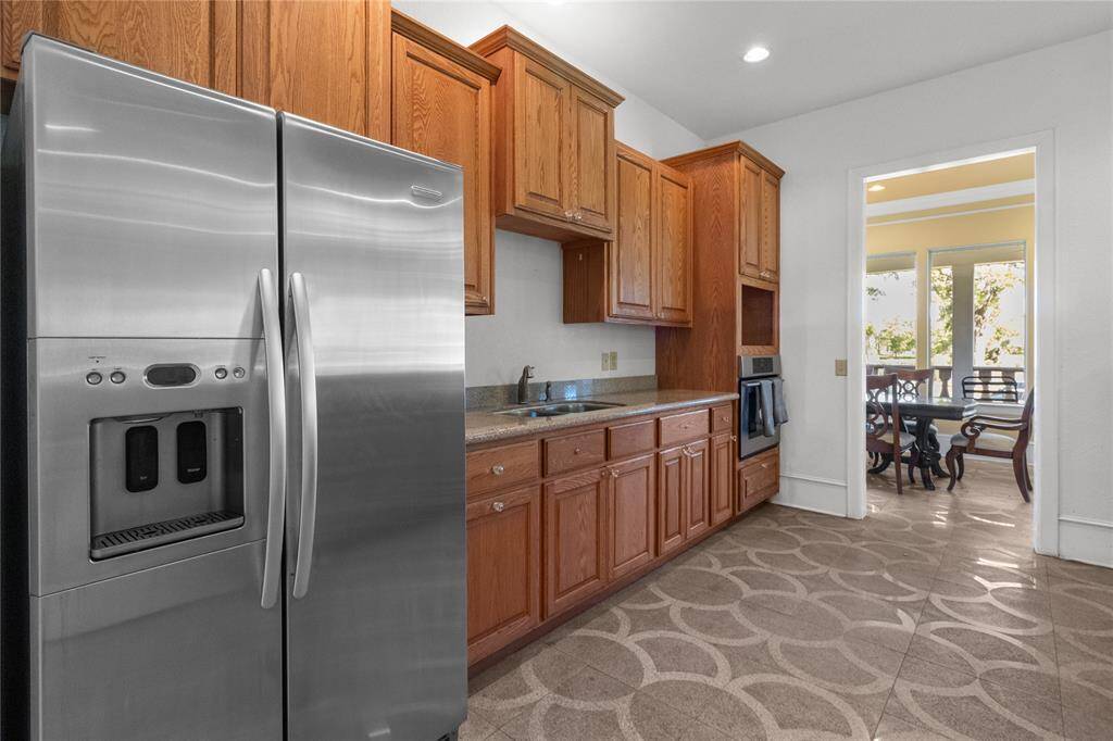 Convenient downstairs half bath with modern fixtures and ample storage.