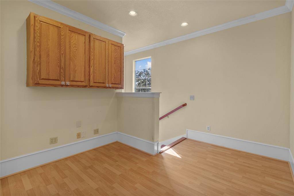 Elegant wooden staircase leading to the upper level, enhancing the home's charm and warmth.