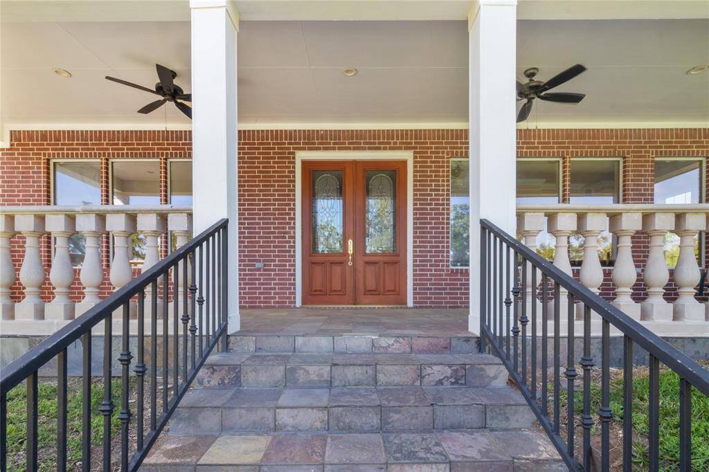 Spacious, elegant porch with scenic views—perfect for relaxing and entertaining.