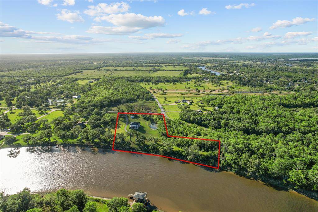 Spacious riverfront property offering stunning views and serene surroundings, perfect for creating your dream home.