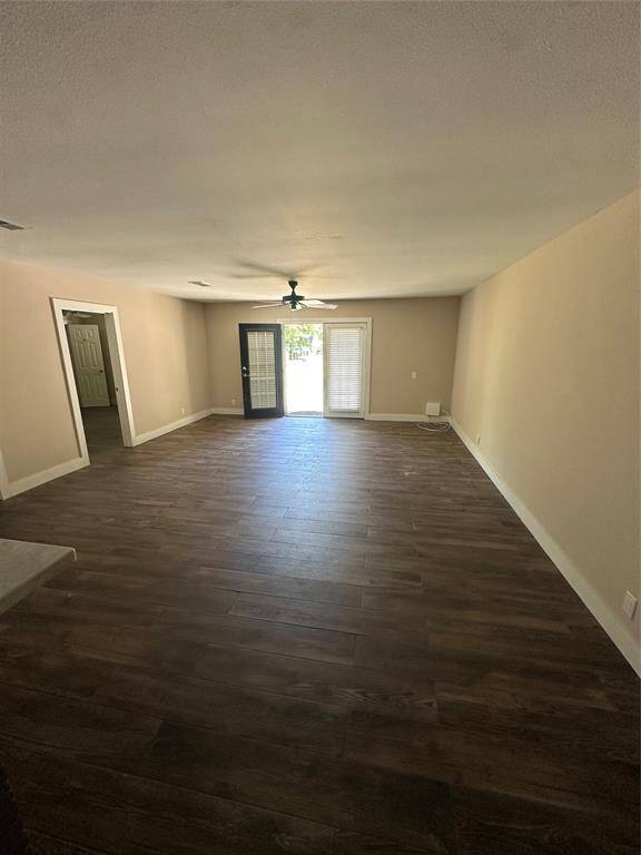 Family room with large doors that open up to the backyard