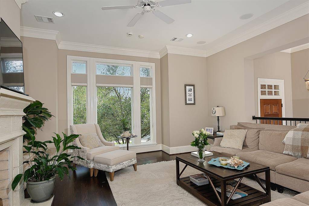 The large window fills room with natural light and welcomes you.
