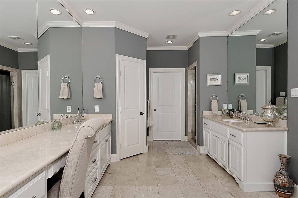 Elegant colors and finishes with quartz counters and marble floors.