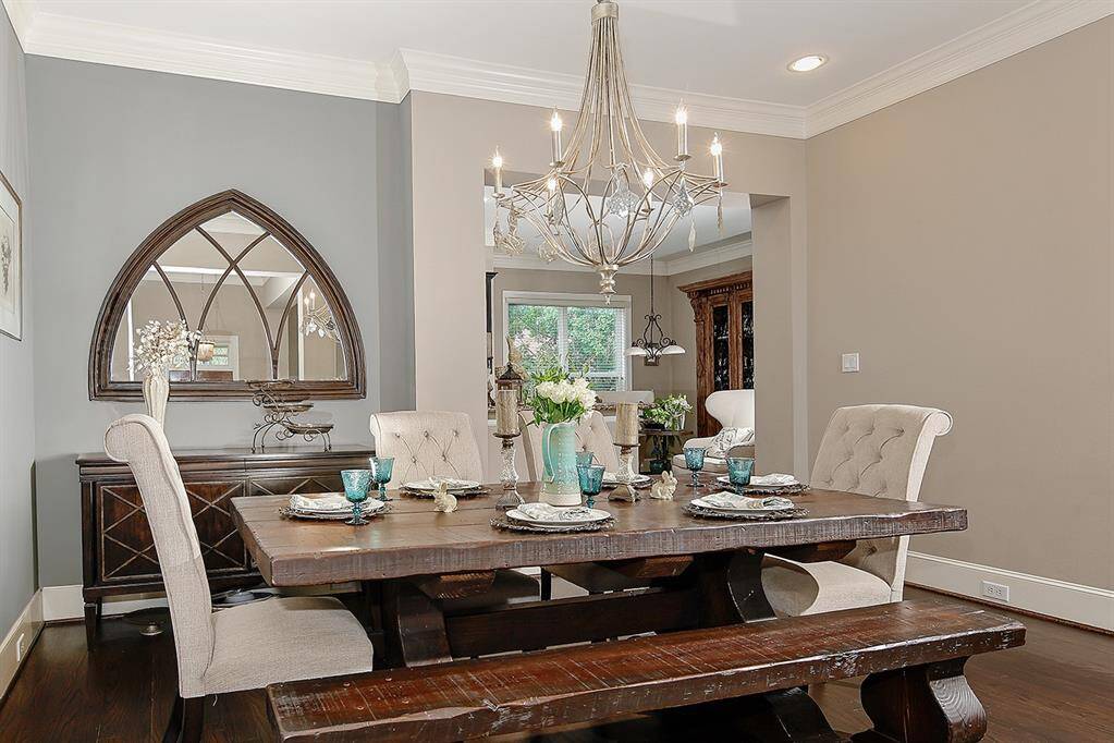 Pleasing neutral tones create an inviting atmosphere crowned with beautiful silver chandelier.