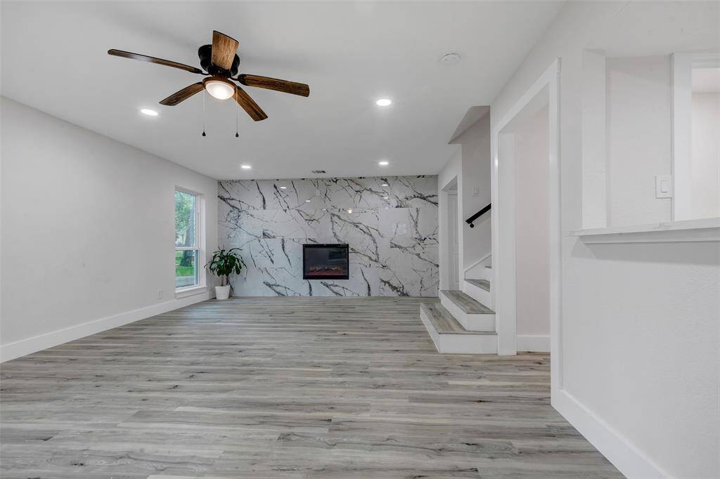Spectacular living room with a lovely electric fireplace for the cold winter days.