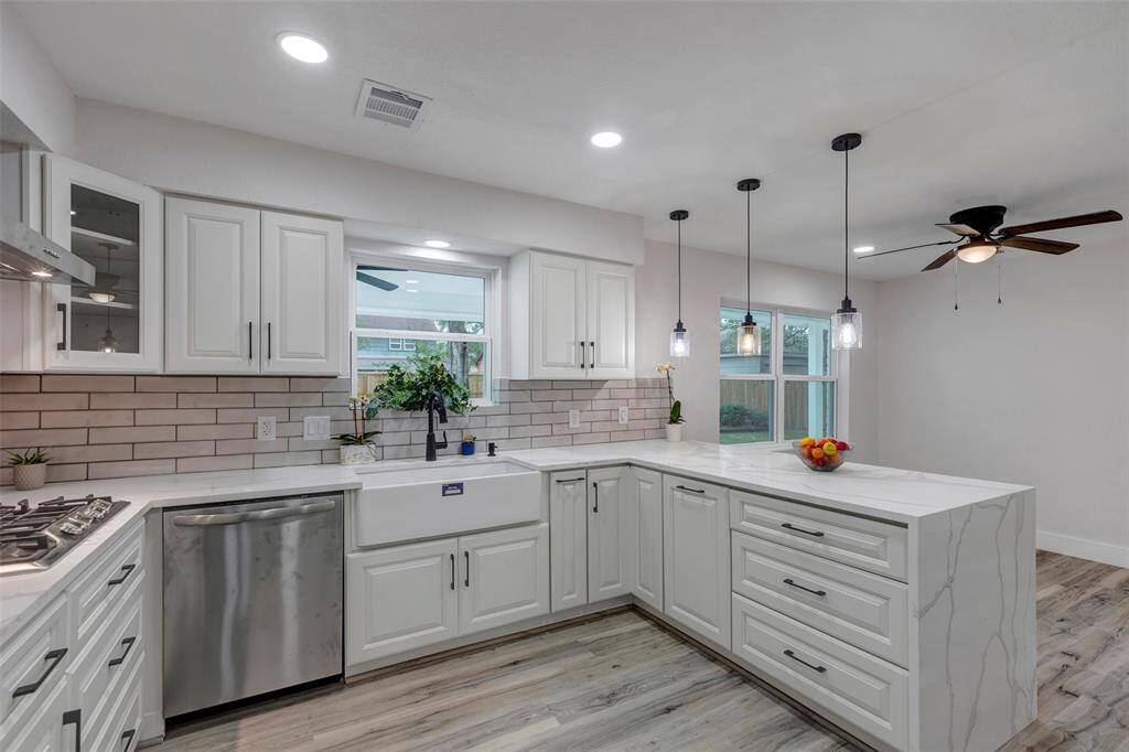 Completely newly remodeled kitchen with new appliances, Quartz countertops, light fixtures, cabinets and Vinyl flooring!