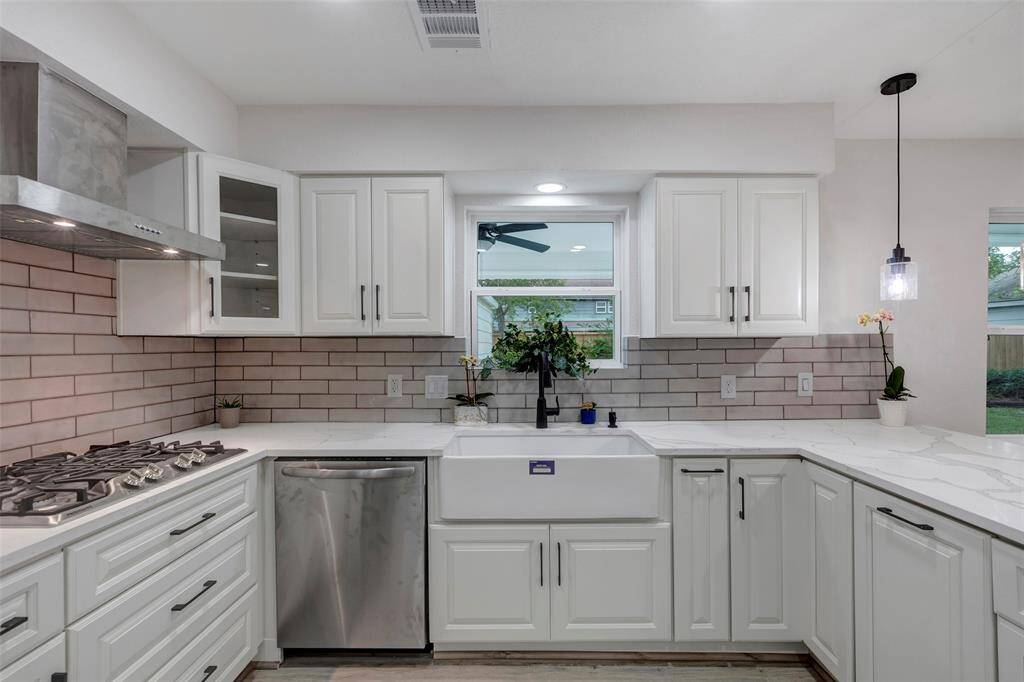 Completely newly remodeled kitchen with new appliances, Quartz countertops, light fixtures and cabinets.