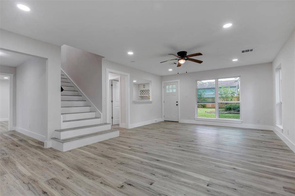 New Vinyl flooring in the living room and throughout the whole house for easy maintenance.