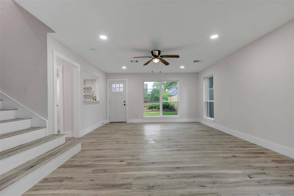 New Vinyl flooring in the living room and throughout the whole house for easy maintenance.