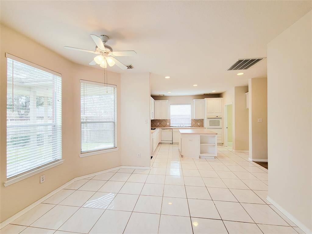 Sunny Breakfast area opens to Kitchen on one side & Family room on the other.