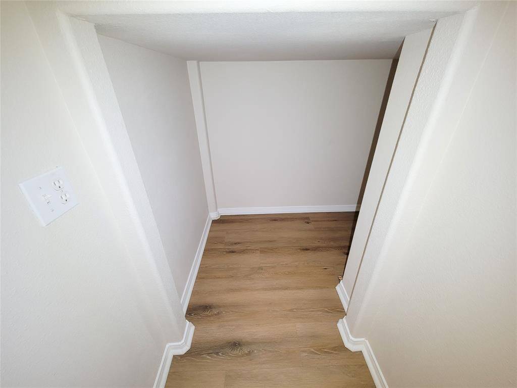Note extra storage space under the staircase.