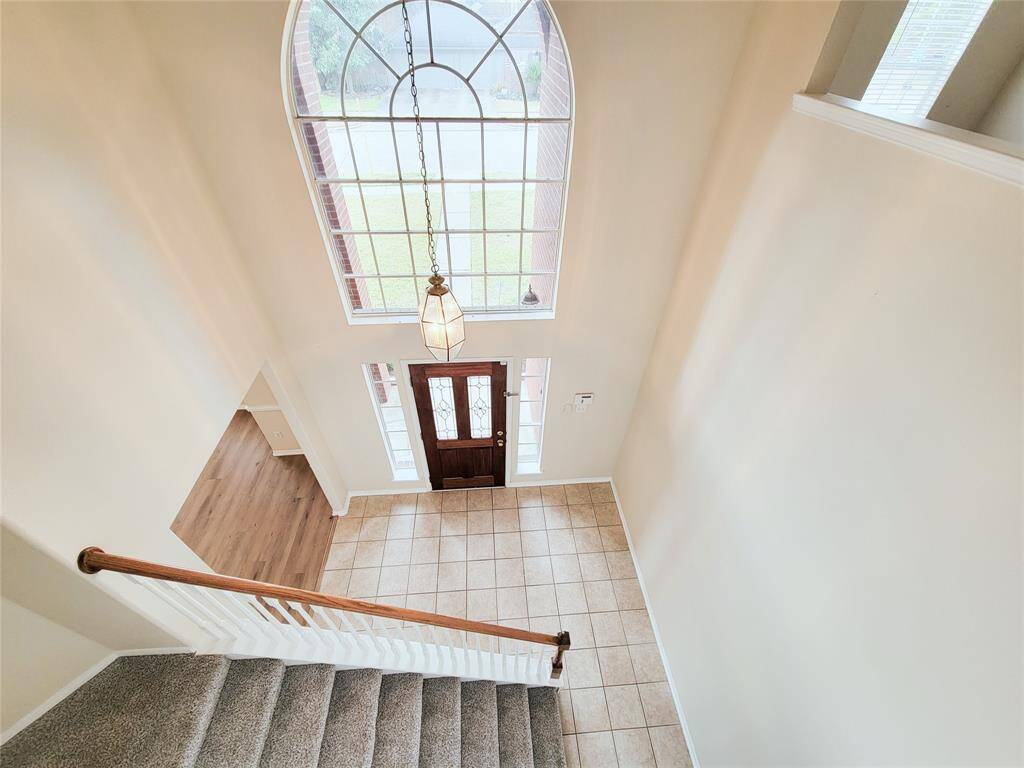 Foyer with two story high ceilings