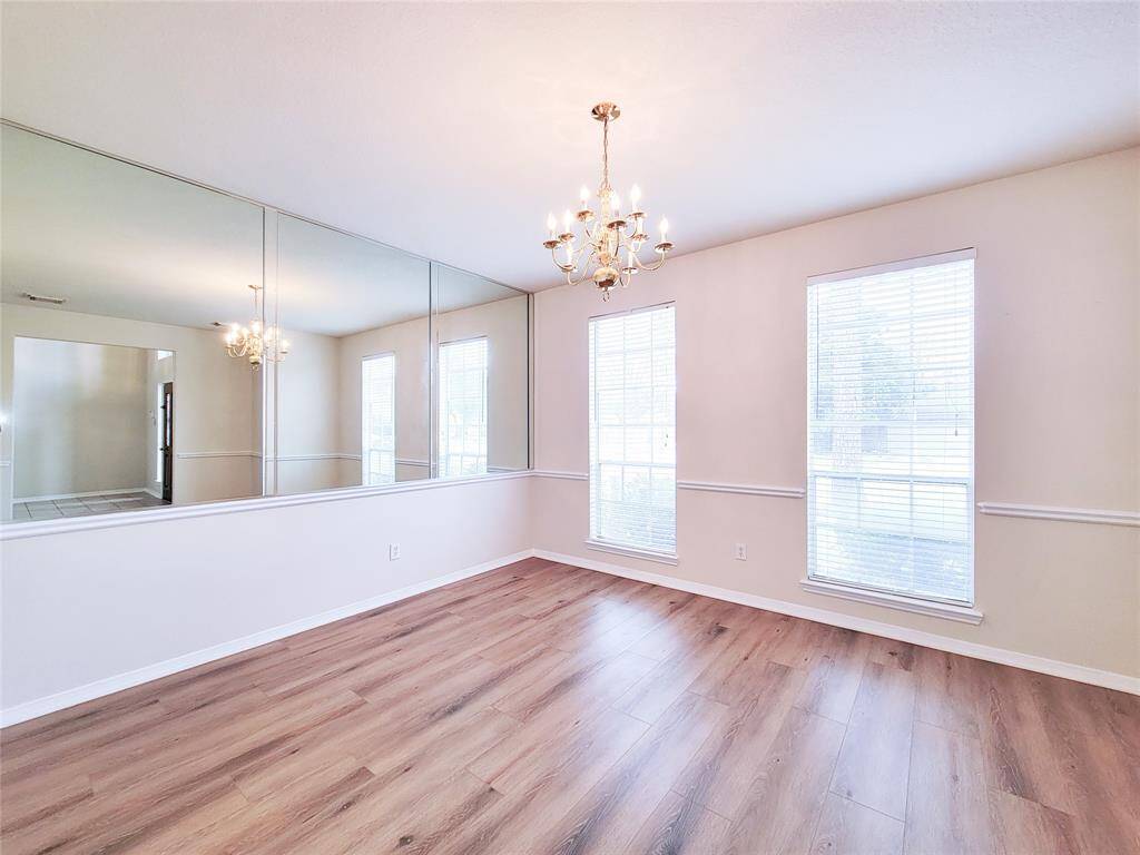 Formal Dining with mirror accent wall.