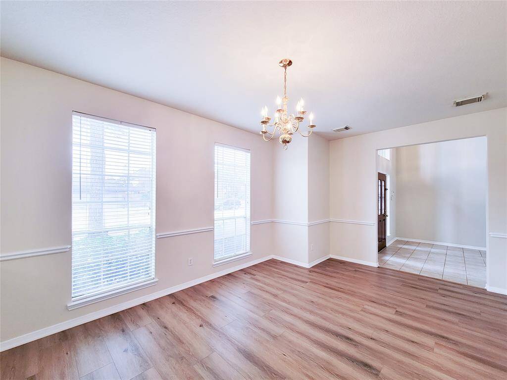 Another view of Dining room. Recently updated with laminate flooring.