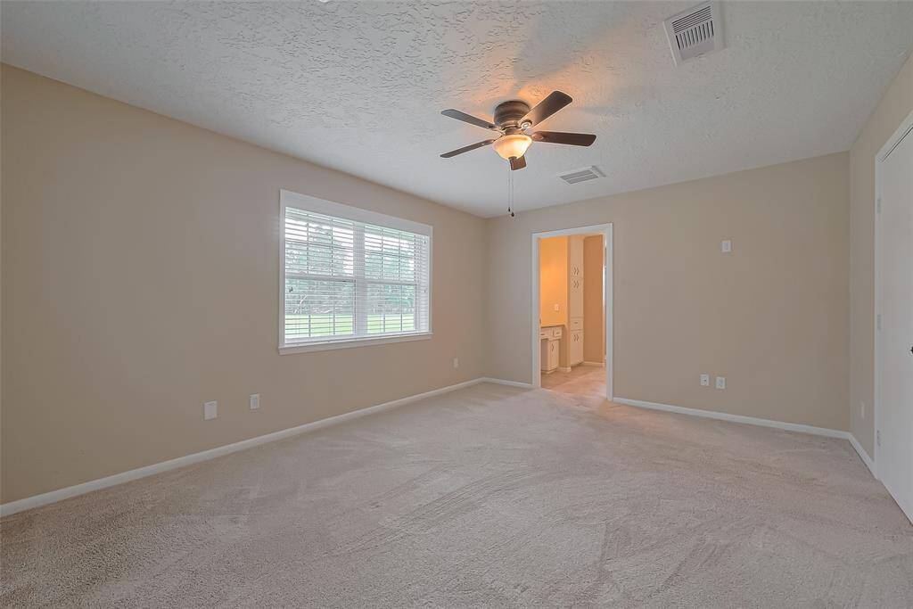 The primary bedroom offers loads of natural light.