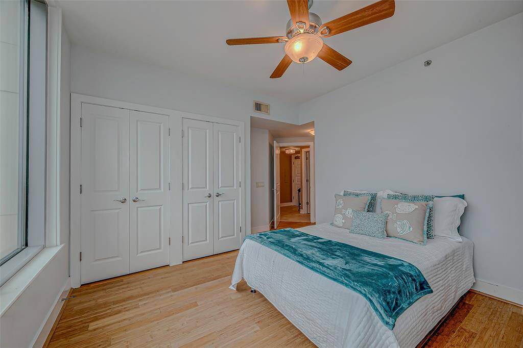 Bright master bedroom with double closets and abundant natural light.