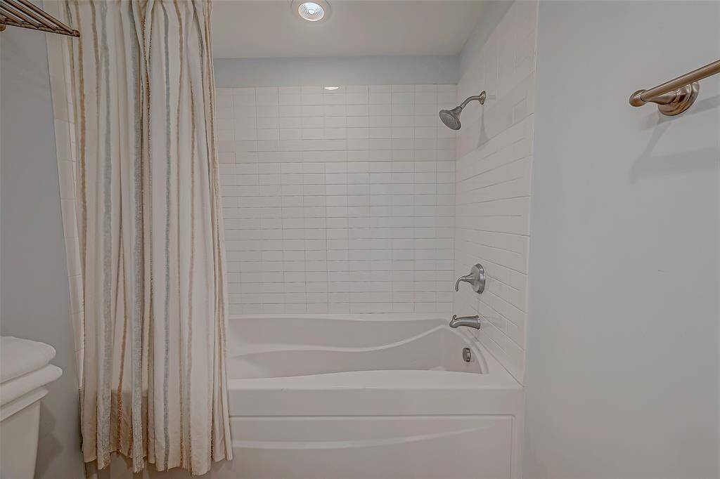 Experience ultimate relaxation with the convenient bathtub and shower combo in the master bathroom.