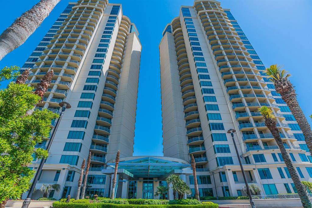 Experience luxury living at Palisade Palms in this stunning 10th-floor Cocoa Beach unit. This 2-bedroom, 2-bathroom condo boasts breathtaking bay and city views from the private balcony. Enjoy modern comforts with a new A/C (2023), bamboo and tile flooring, and floor-to-ceiling windows in the den.
