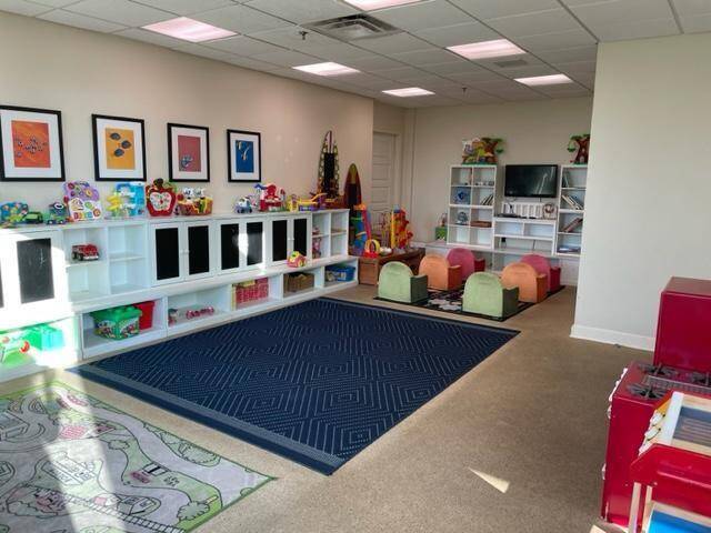 Perfect indoor playroom for endless creativity, paired with an outdoor pool and nearby beach for family fun.