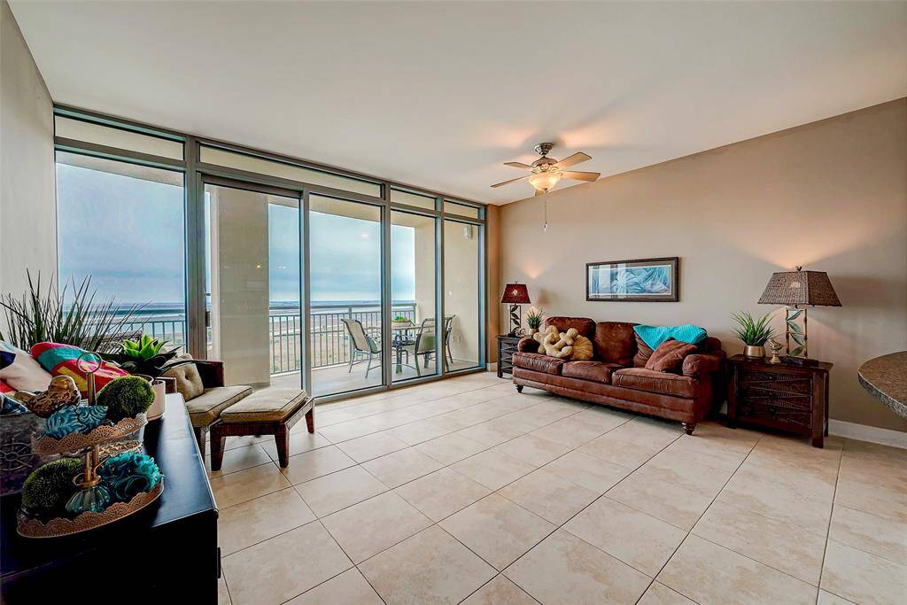 Spacious open floorplan with a large den, featuring easy-care tile flooring and stylish decor accents.
