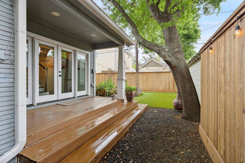 Outside, enjoy a fully fenced yard with easy to maintain turf and a picture perfect porch.