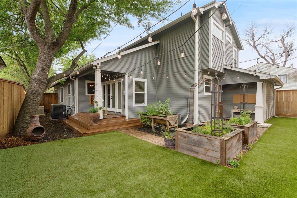 This backyard is a gardeners' dream with custom designed and built cedar beds.