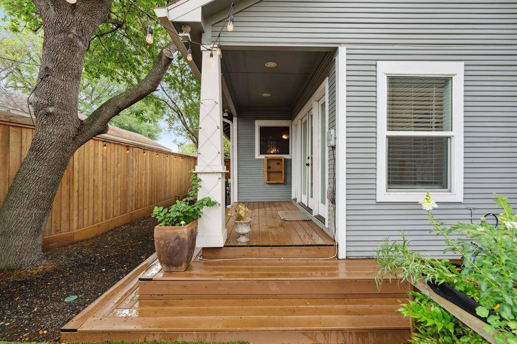 This covered back patio is the perfect spot to be on a sunny day.