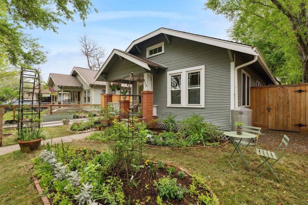 A picturesque front yard adorned with a charming garden.