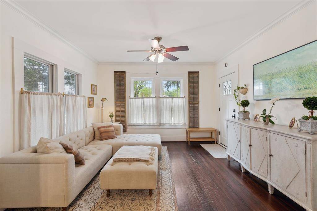 As you enter you are greeted by charming details such as picturesque windows, gleaming hardwood floors and sleek finishes.