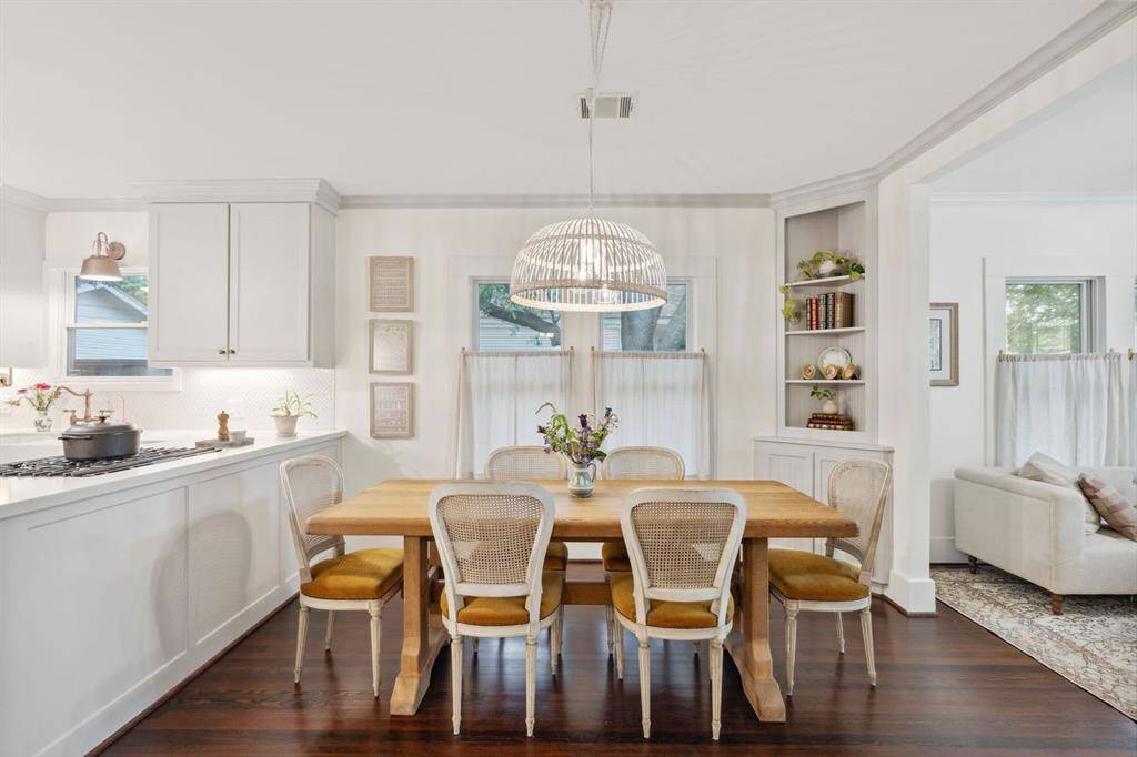 A cozy dining room is perfectly situated between the living room and kitchen.