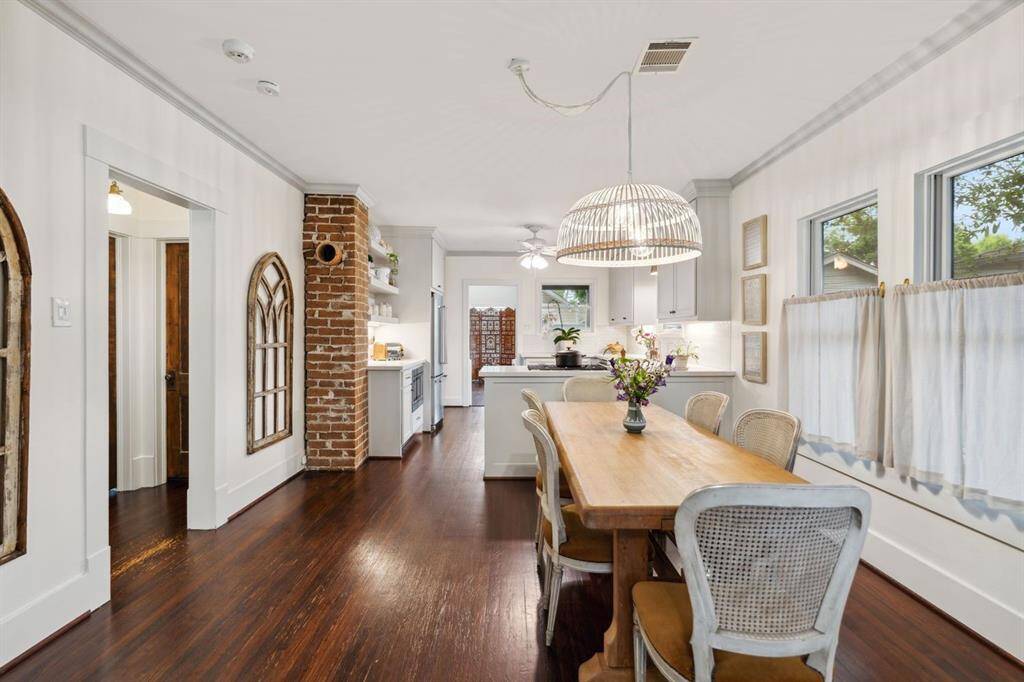 Lovely brick accents tie the spaces together.