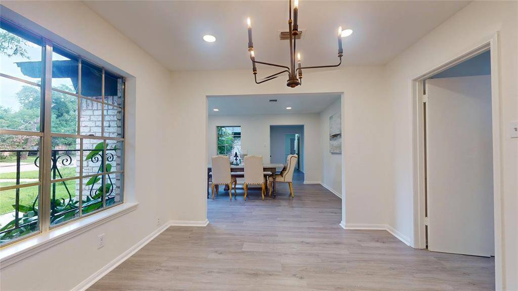 The dining set we used for staging is fairly large (bulky chairs :-)) so we chose to set it up in the formal living room. The dining room could be a secondary sitting area to enjoy a good book or the views of the wooded street!