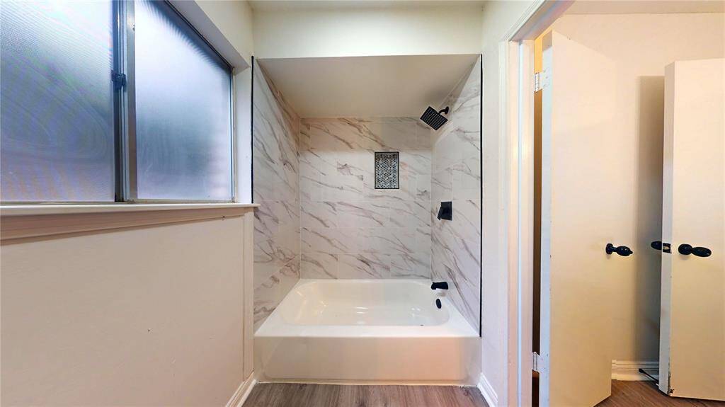 Full bath with separate tub area..