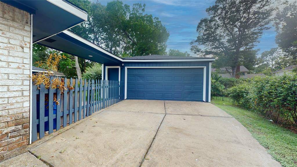 Double drive-way leading to detached garage...