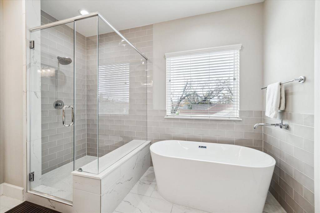 Large soaking tub and stand alone shower.