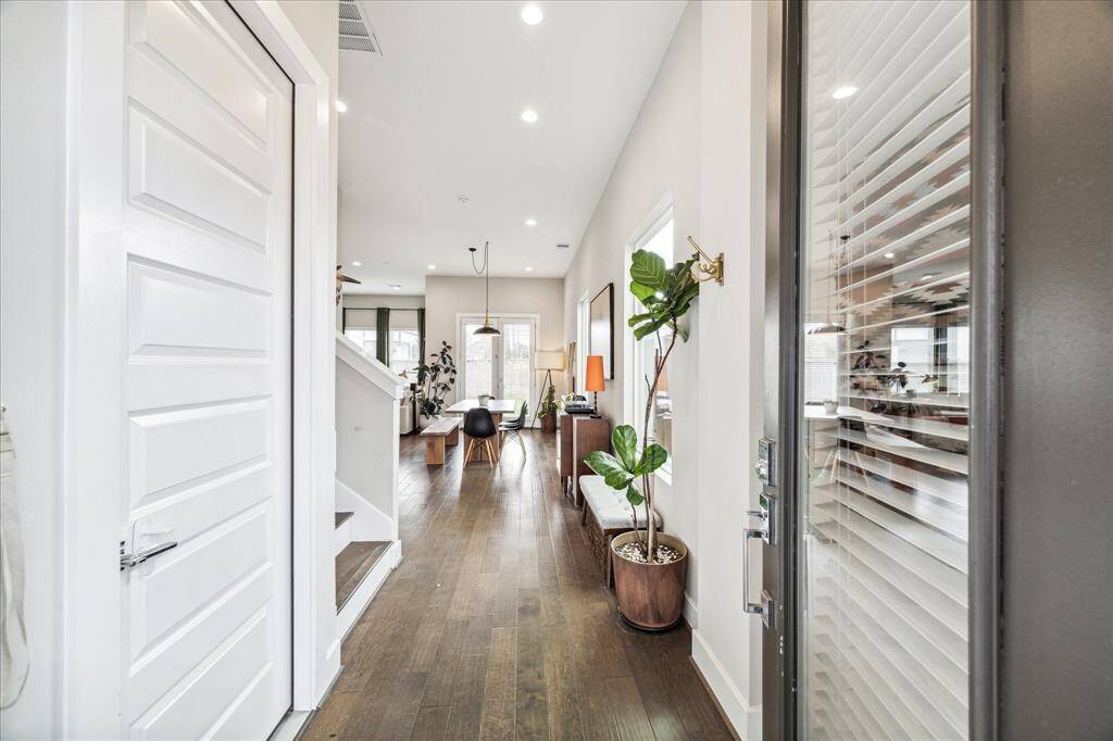 Entering into the home you are greeted with soar ceilings throughout.