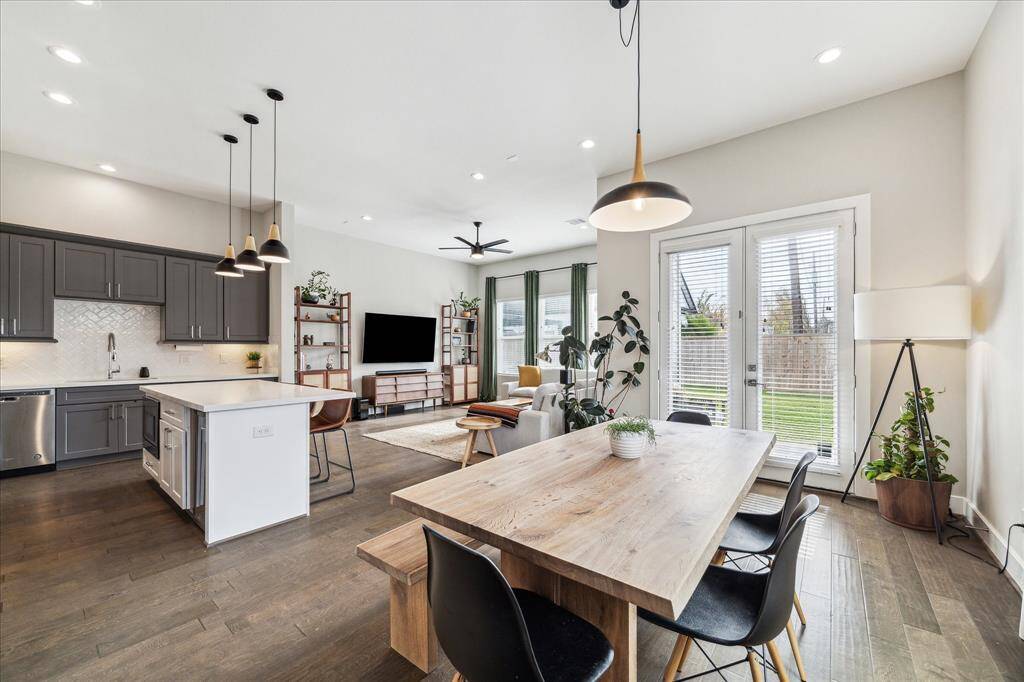 Open concept dining room with double doors that lead outside to your covered patio.