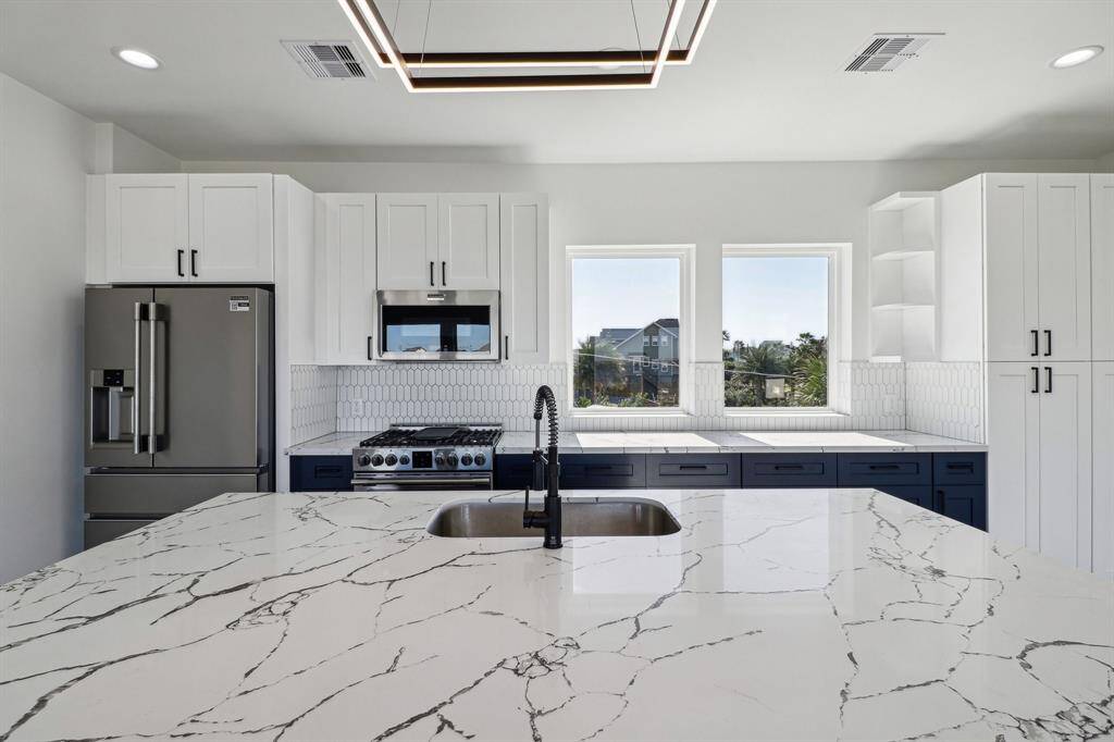 Custom cabinets and beautiful quartz countertops in the kitchen combining functionality with elegant design