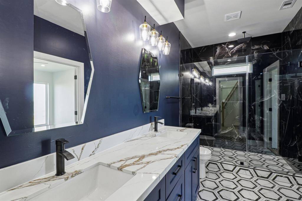 Custom primary bath with rain shower and double vanities for ultimate relaxation
